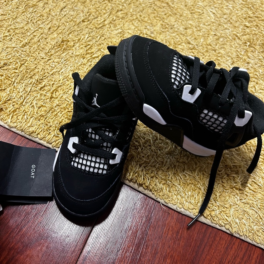 Jordan 4 black and white.  Size 10c